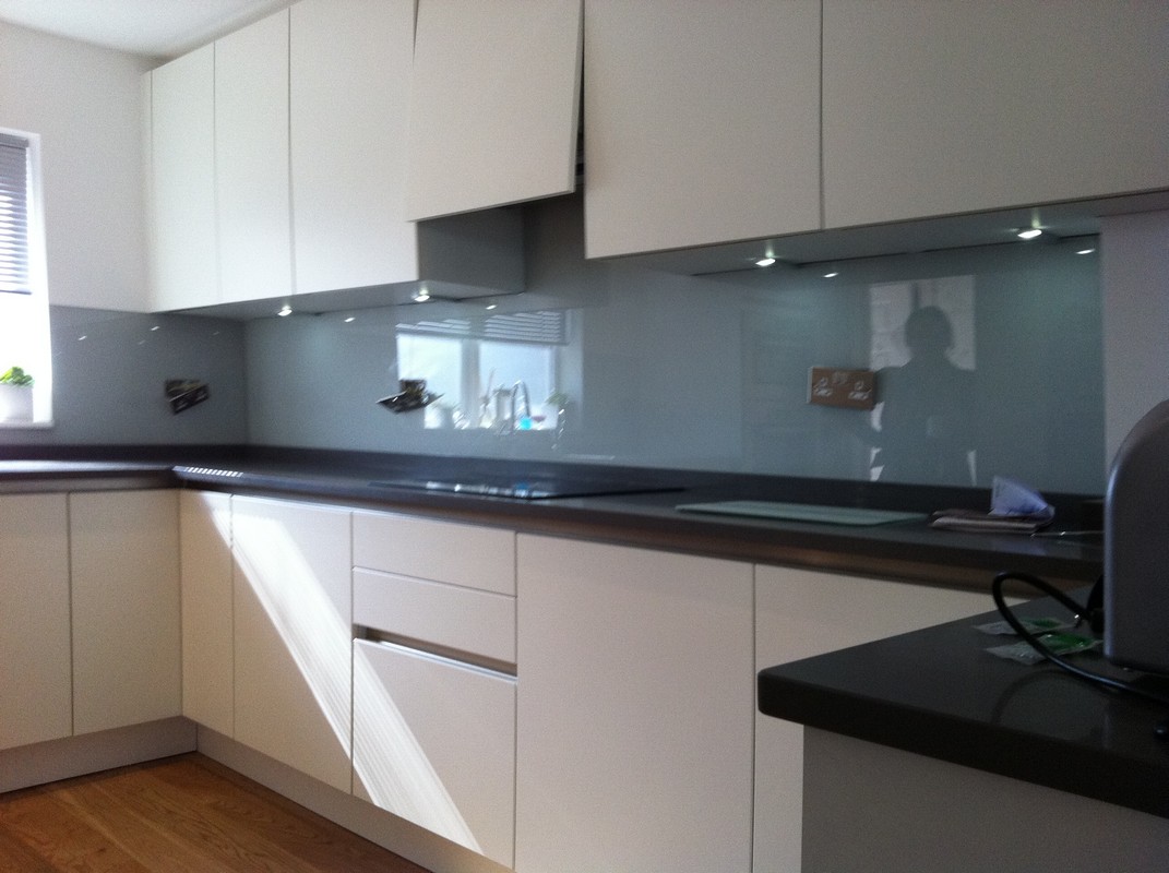 Grey glass kitchen splashback with LED lighting in Brentford