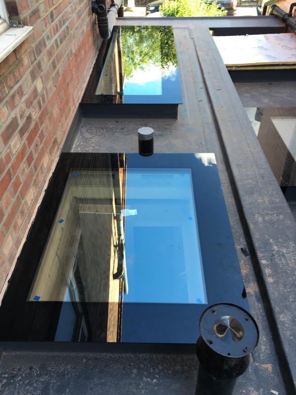 Multiple flat roof skylights on extension in Brentford