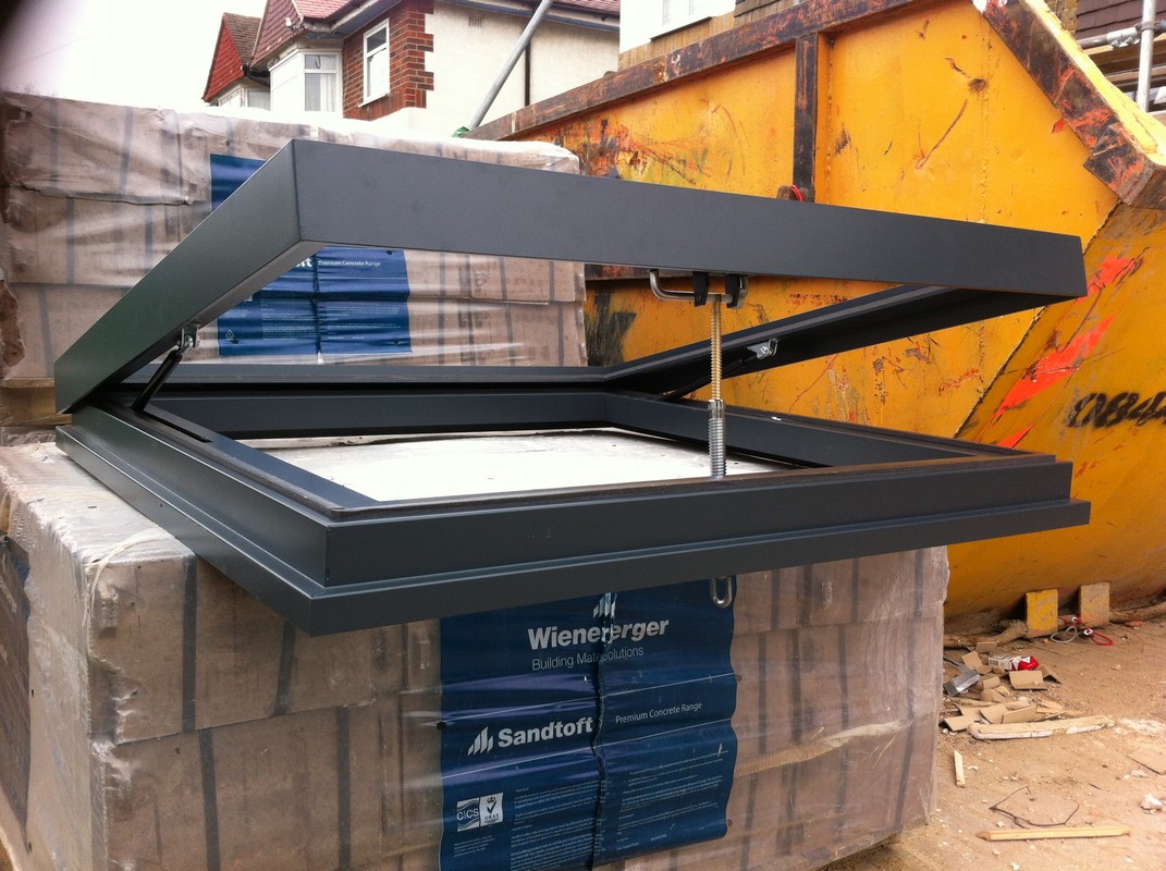 Opening flat roof skylight in anthracite grey installed in Brentford